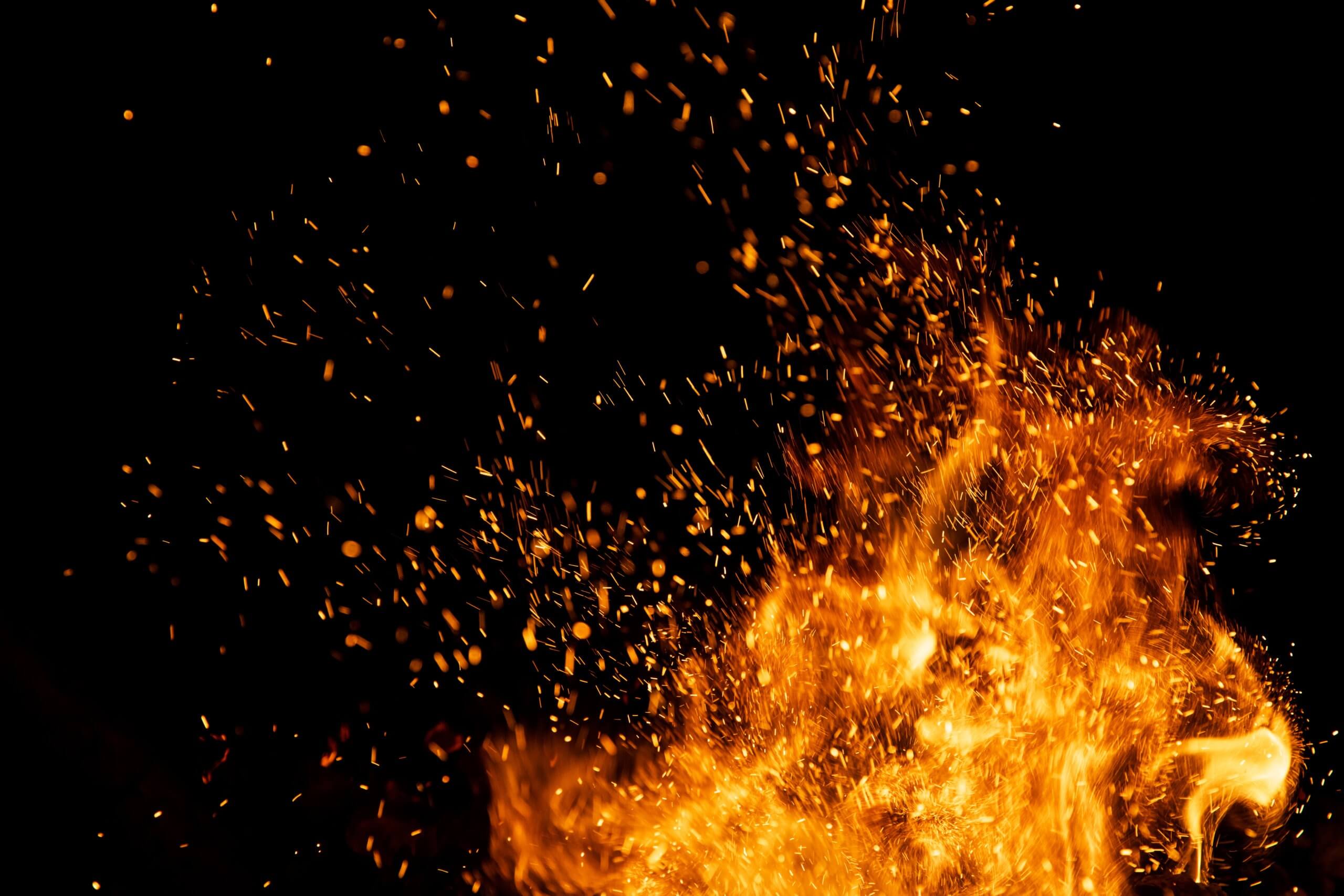Fire,Sparks,Particles,With,Flames,Isolated,On,Black,Background. Fire,Sparks,Particles,With,Flames,Isolated,On,Black,Background.