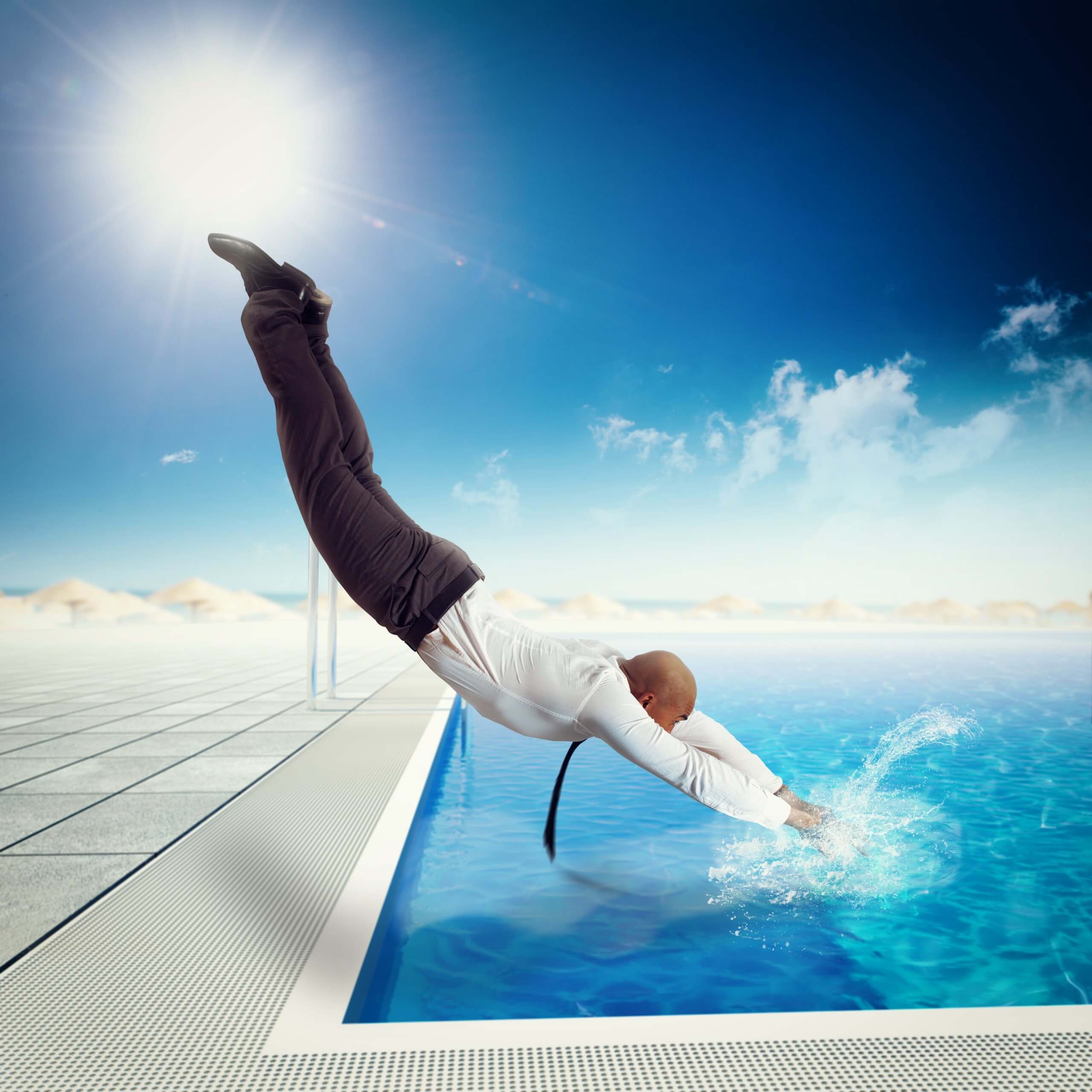 Businessman,Suit,Dives,Into,The,Swimming,Pool