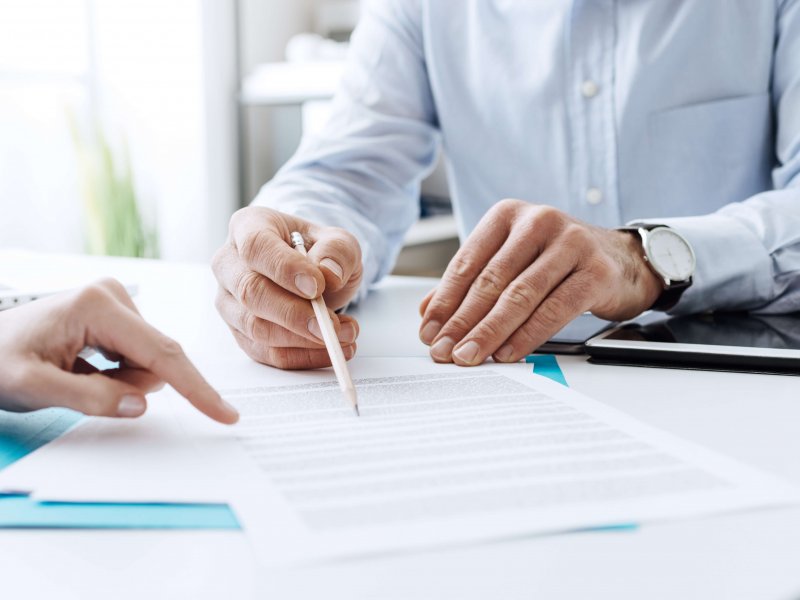 Business people negotiating a contract Business people negotiating a contract