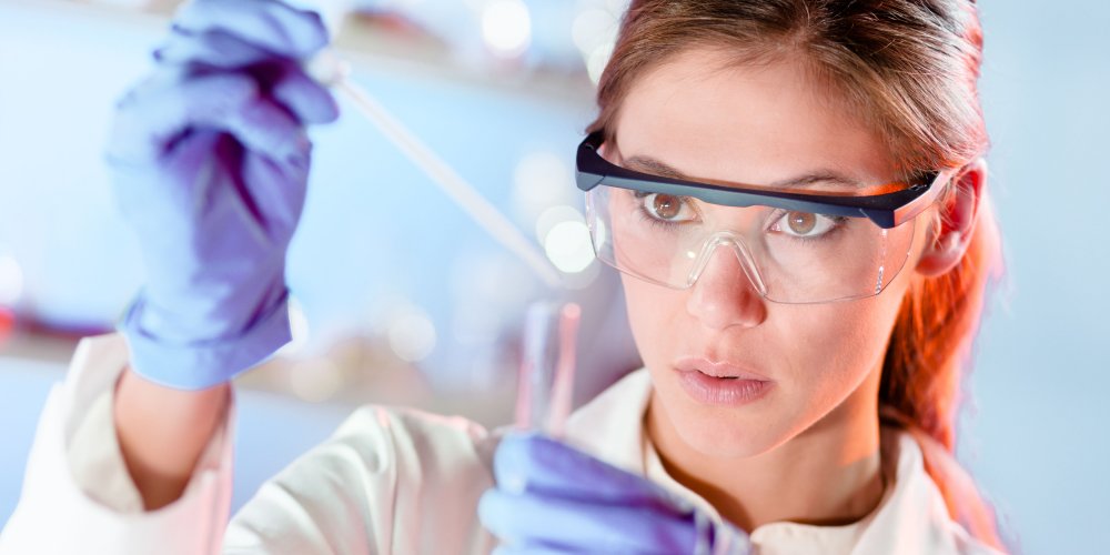 Young scientist pipetting in life science laboratory. Young scientist pipetting in life science laboratory.