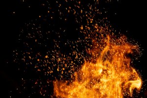 Fire,Sparks,Particles,With,Flames,Isolated,On,Black,Background.