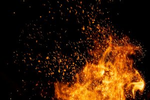 Fire,Sparks,Particles,With,Flames,Isolated,On,Black,Background. Fire,Sparks,Particles,With,Flames,Isolated,On,Black,Background.